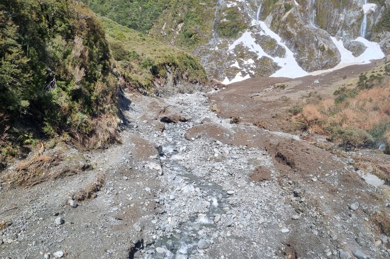 Avalanche debris crosses the Milford track